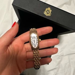 Craig Shelly. Women's Gold-Tone Oval Bracelet Watch with White Dial